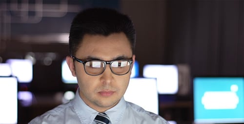 Man Working at Computer Late at Night