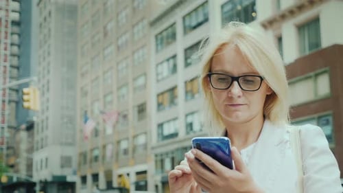 Attractive Woman Using Smartphone in Downtown New York