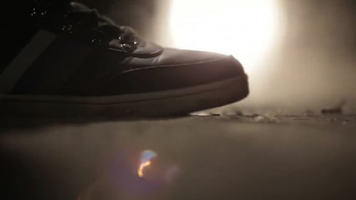Single Athletic Shoe Enters Smoky, Dark Space