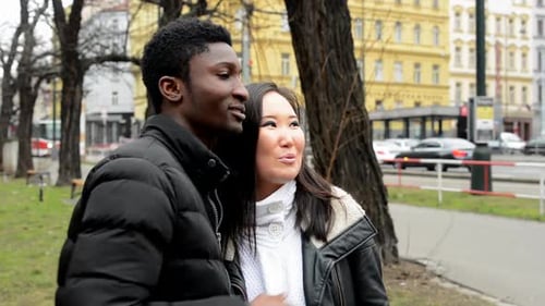 Happy Couple Point To the Distance (Sightseeing) - Urban Street with Cars - City