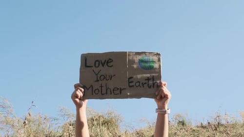 Person Holding Love Your Mother Earth Sign