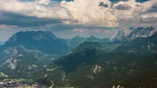 Timelapse scenery with mountain peaks and cloudy sky. Amazing landscape on mountain