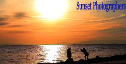 Silhouettes on Beach at Colorful Sunset