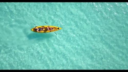 Boy and girl relax on exotic coast beach voyage by shallow lagoon and white sandy background of the
