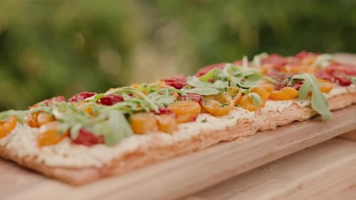 Delicious Tart with Cheese, Tomatoes, and Arugula