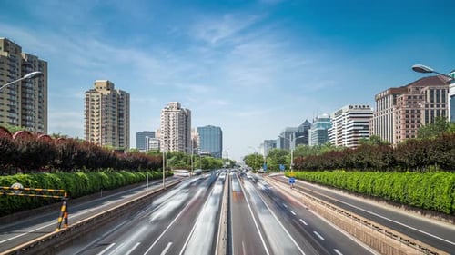 Time lapse of busy traffic and modern buildings in Beijing city , China.