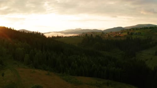 Aerial View of Green Mountains at Sunset