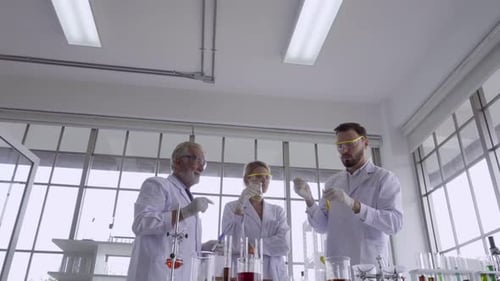 Scientists Conducting Research in Bright Laboratory