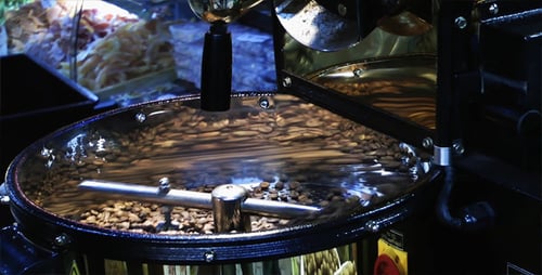 Coffee Beans Roasting Inside a Shiny Metal Machine