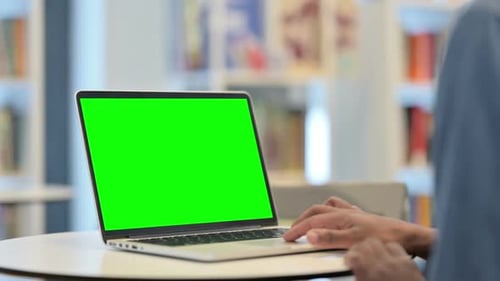 Man Using Laptop with Green Chroma Key Screen Close Up
