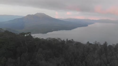 Aerial View of Mount Batur and Lake Batur in the Evening with the Evaporation of Clouds
