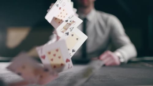 Man Throws Deck of Cards in Slow Motion