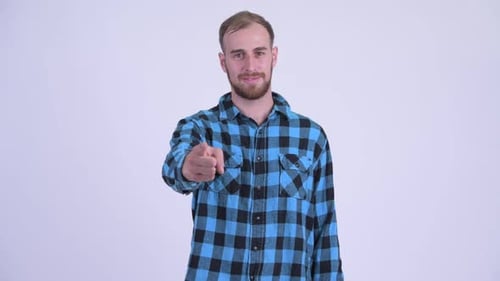 Man Smiling, Pointing, and Giving Thumbs Up