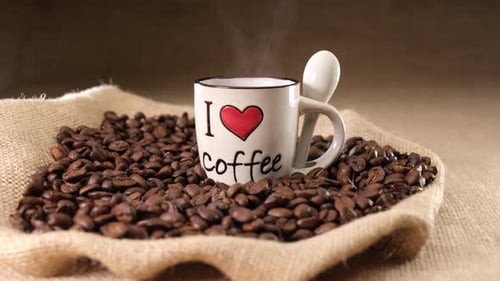 Coffee Mug Surrounded by Roasted Coffee Beans