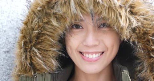 Smiling Person With Fur Lined Hood Up Close
