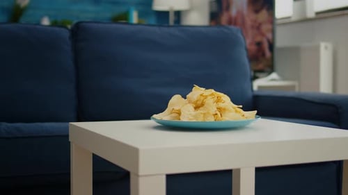 Delicious Potato Chips on Plate in Home