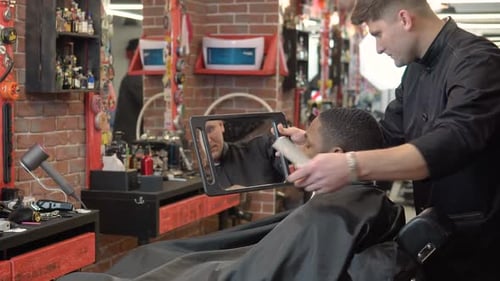 Trendy Barbershop Customer Sees Fresh Haircut in Mirror