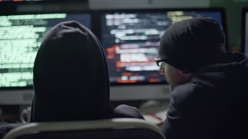 Three Coders Hacking in Dark Office at Night