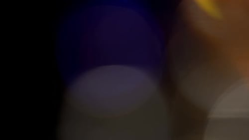 Multicolored Light Leaks Footage on Black Background Stylizing Video Transitions Bokeh Effect