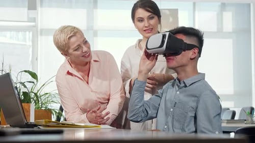 Colleagues Working with Virtual Reality Headset in Office
