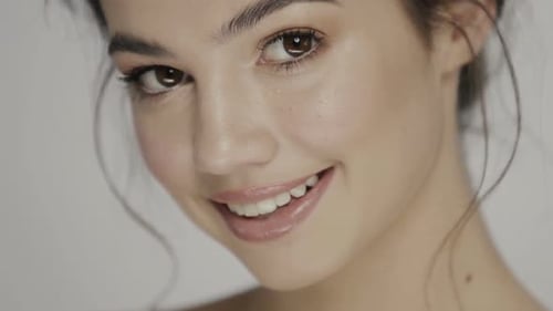 Close Up of a Beautiful Young Woman Smiling