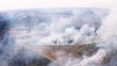 Aerial View of Large Fire Burning in Rural Area