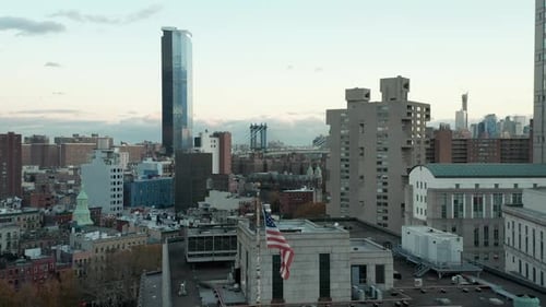 Aerial View of Buildings and an American Flag