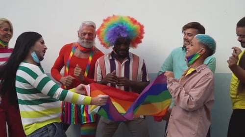 Diverse Group Celebrates Pride With Rainbow Flag