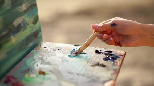 Close Up Shot of the Process of Mixing Oil Paint with Palette Knife