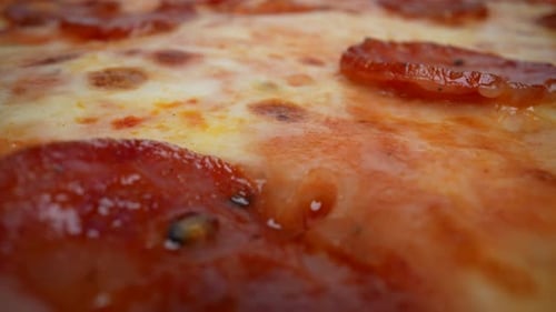 Close-Up View of Hot Pepperoni Pizza