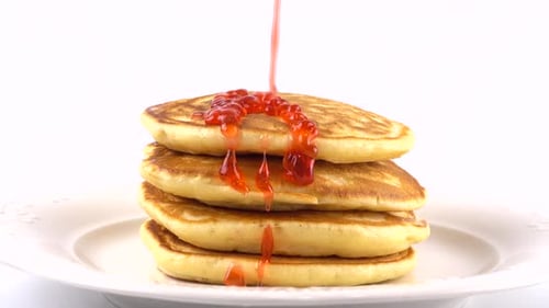 Pancakes Stack Drizzled with Sweet Strawberry Jam