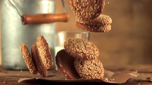 Super Slow Motion Oatmeal Cookies Falls on the Table on Paper