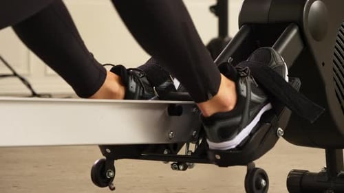 Woman Working Out on a Rowing Machine