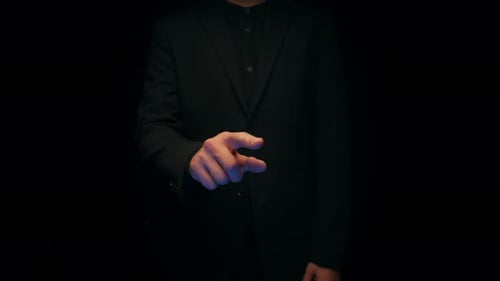 Man in Suit Interacts with Touchscreen Interface