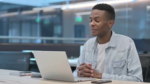 Young Adult Man Talking During a Video Call