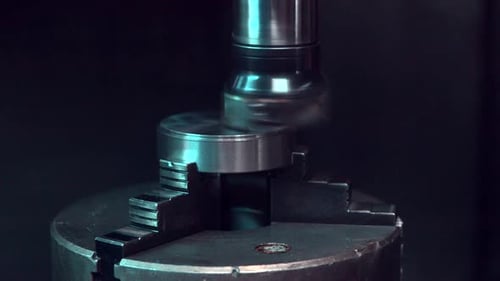 Close Up Milling Machine Cuts Metal Object