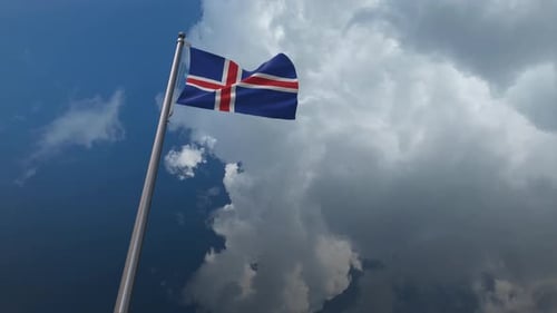 Iceland National Flag Waving in Wind Against Cloudy Sky