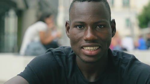 Smiling Young Adult in an Urban Environment