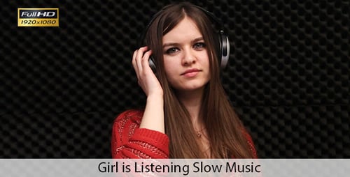 Young Woman Listening to Music on Headphones