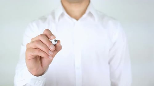 Adult Writes 'Devices' on Transparent Surface