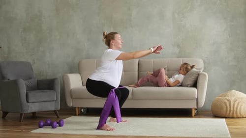 Pregnant Woman Doing Squats at Home