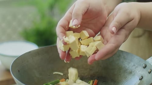 Adding Tofu to Vegetable Stir-fry in a Skillet