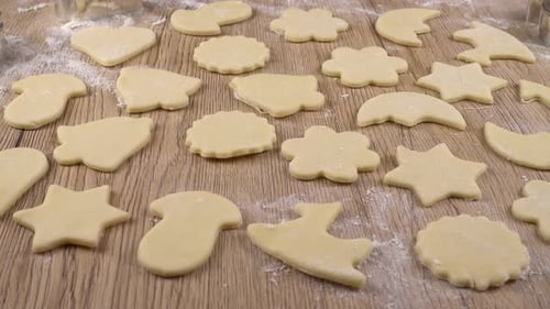 Fresh Sugar Cookie Cutouts on Wood Surface