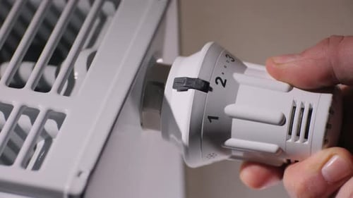Hand Adjusting Radiator Thermostat for Climate Control
