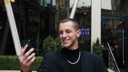 Friendly Caucasian Businessman Talking Video Chat Outside City Street. Happy Man Call Video Online