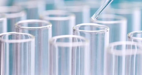 Liquid Being Added to Test Tubes in Lab