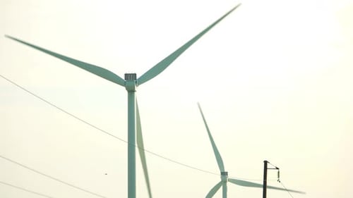 Working Wind Turbine Against Clear Sky