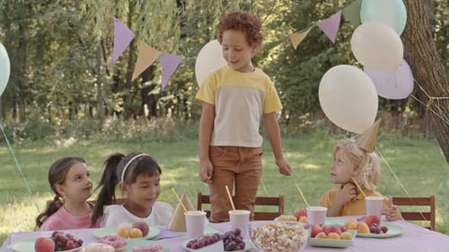 Children at Birthday Party Outdoors in Rural Setting