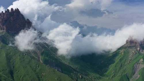 Aerial View of Verdant Mountains with Clouds