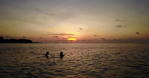 Beautiful man and woman on romantic honeymoon enjoy luxury on beach on summer white sandy background